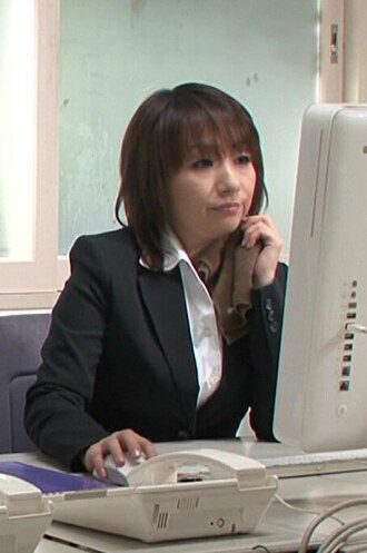 Mature female employees doing naughty things at the office